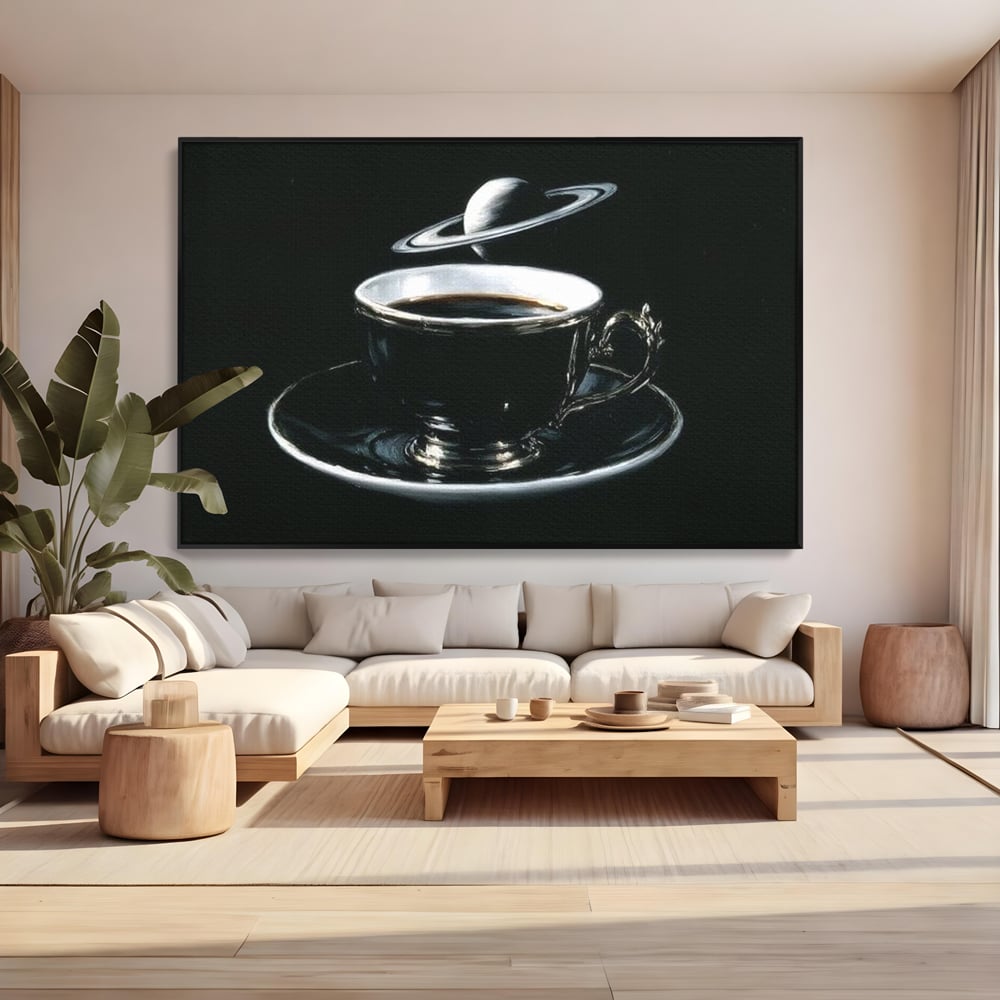 Tablou canvas cu tablou canvas cu ceasca de cafea si planeta, in rama de aluminiu negru, pe perete intr-un living